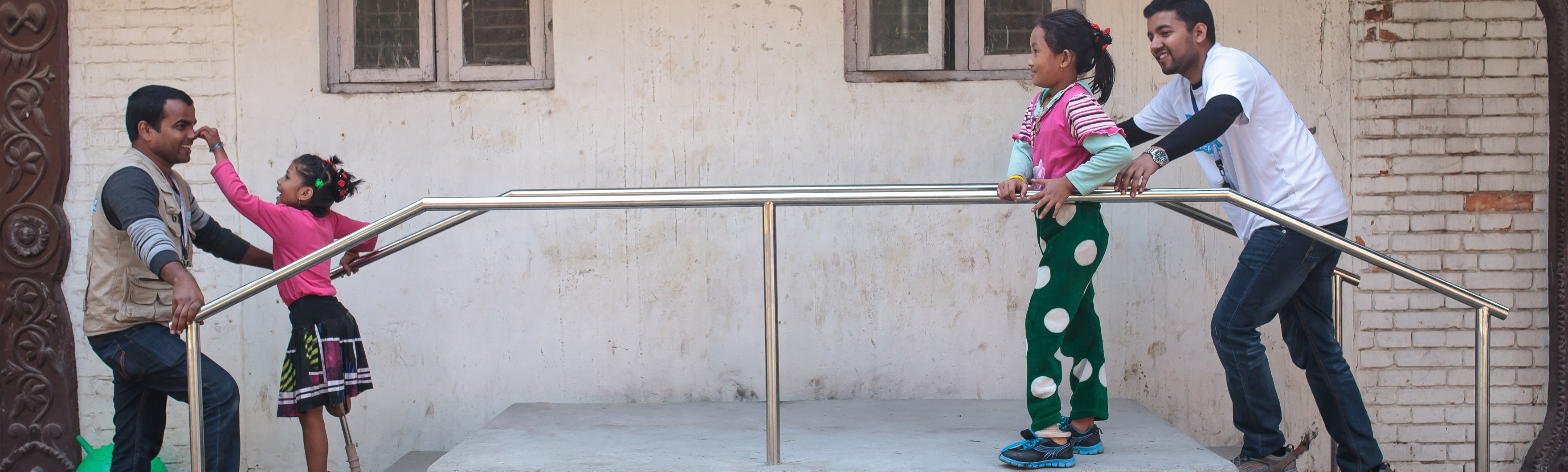 Nepal, Nirmala (left), with Jay from HI and Khendo (right) with Sudan from HI. Girls were both victims of the 2015 earthquake, fitted with a prosthesis, they follow rehabilitation sessions.