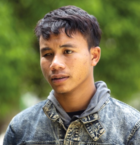 Portrait of a young Laotian victim of cluster munitions