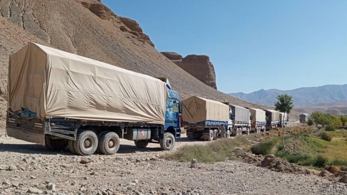 Convoys transporting cement and food products in Ghor province, Afghanistan.; }}